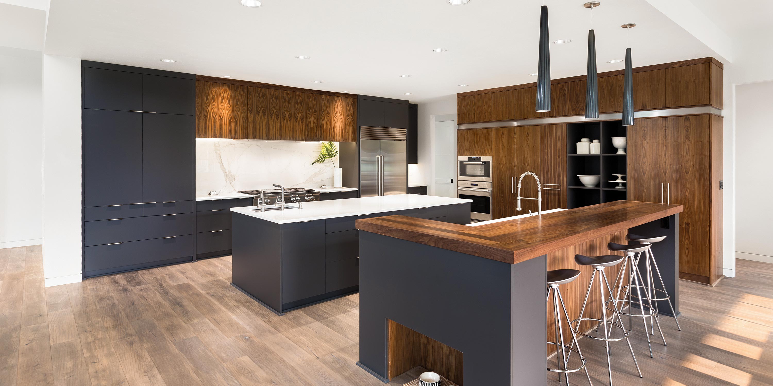 Spacious kitchen with dark cabinets and wood accents.