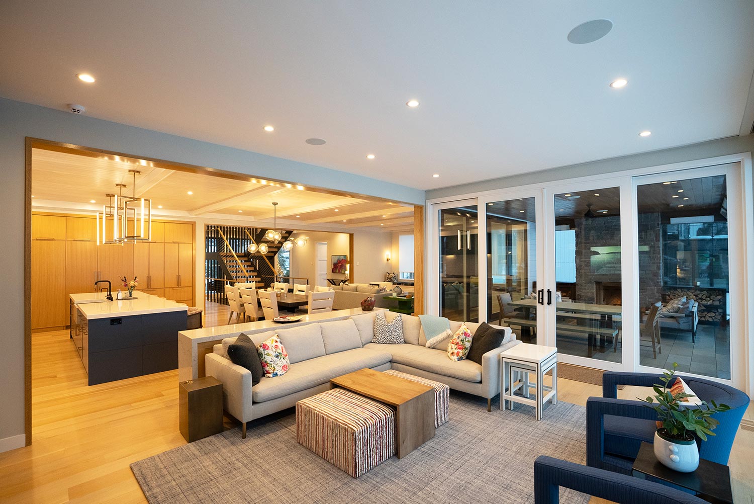 Spacious open-concept living area connected to kitchen and dining room