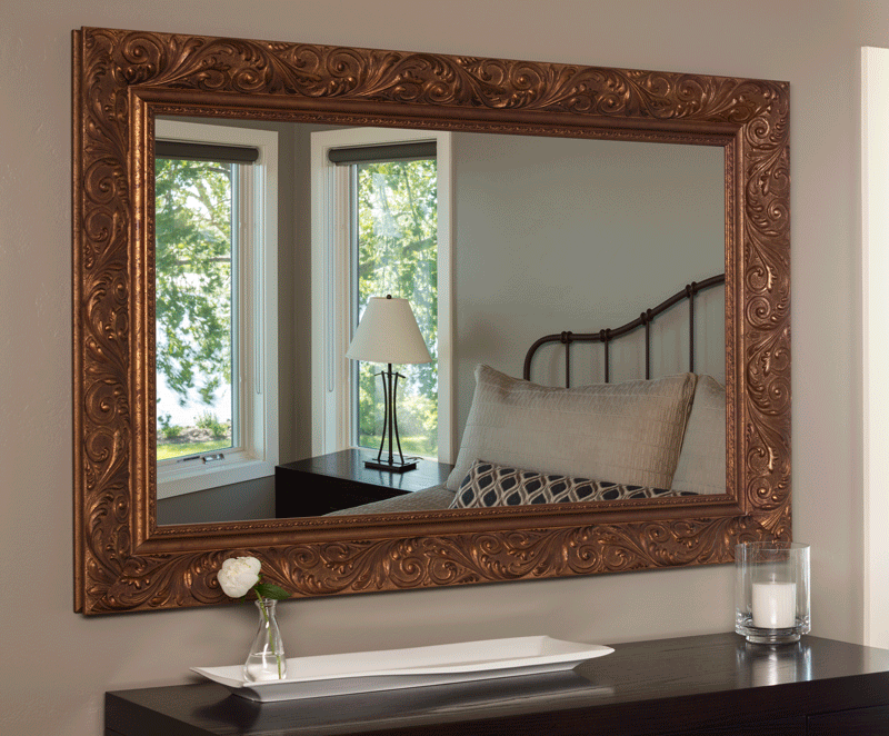 A close-up animation of a mirror TV transitioning from reflective to display mode.