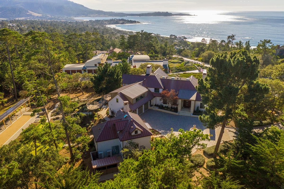 Coastal hillside property overlooking the ocean with dense pine trees