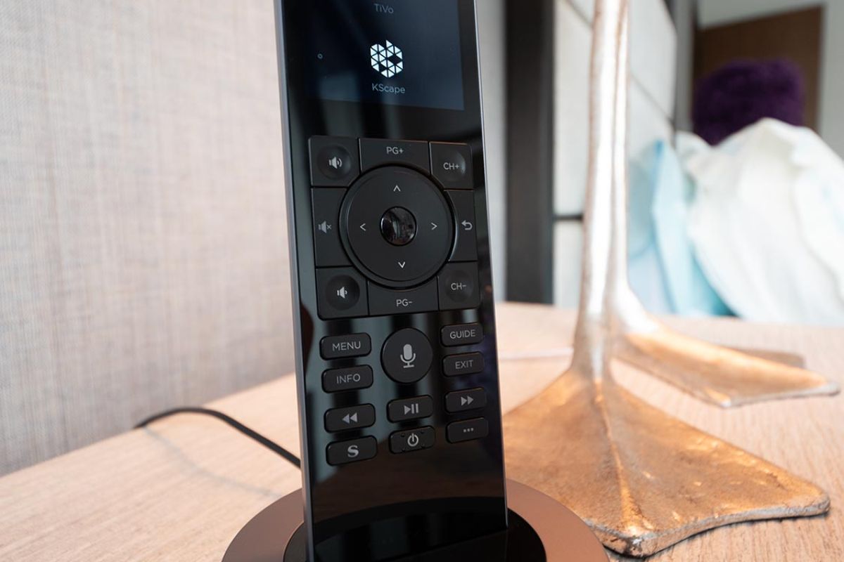 Smart remote control on docking station placed on a bedside table