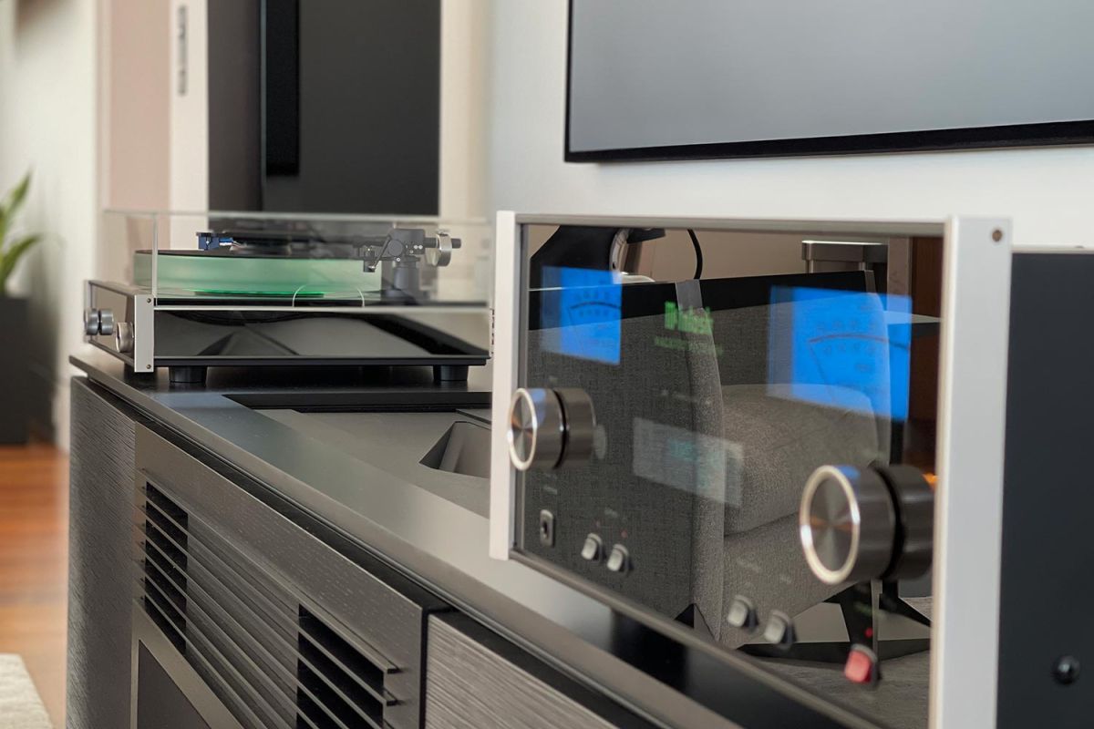 Close-up of high-end audio equipment with turntable and stereo amplifier