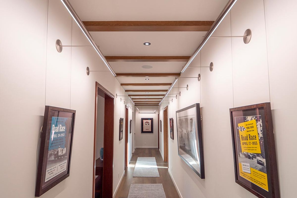 Art gallery hallway with wood floor and ceiling beams