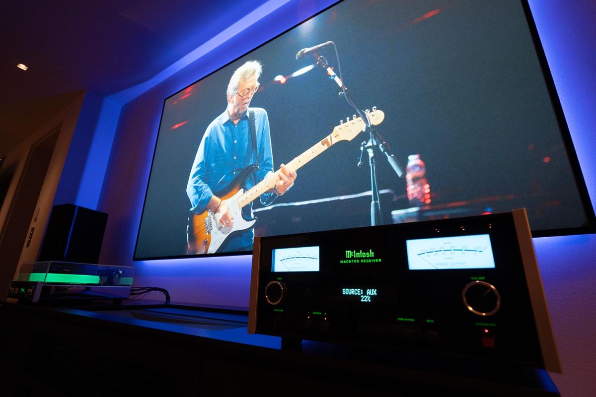 McIntosh audio system and turntable in media room with concert on screen
