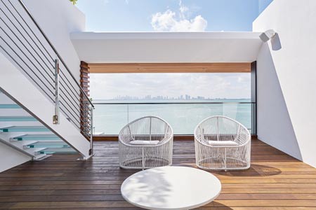 view of the city from inside a patio with two chairs